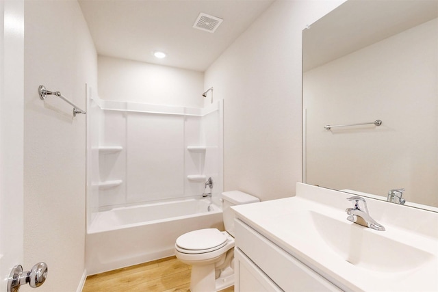 789 Merry Summit Rd, Lavon, TX 75166 - bathroom with visible vents, wood finished floors, vanity, toilet, and shower / bathtub combination