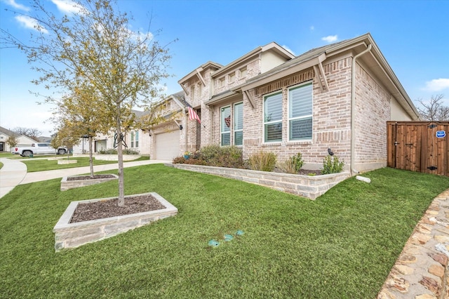 view of front of house featuring a garage and a front lawn