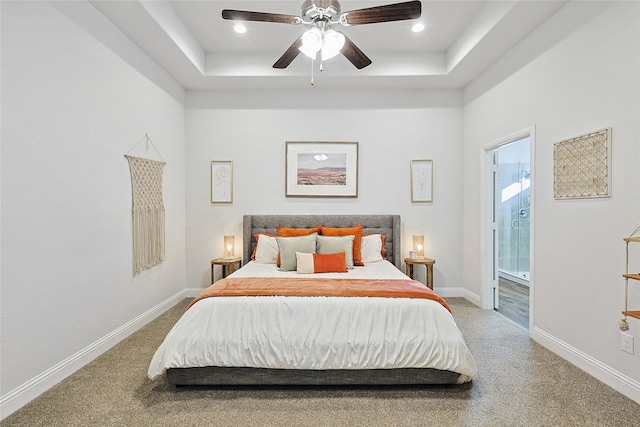 carpeted bedroom featuring connected bathroom and ceiling fan