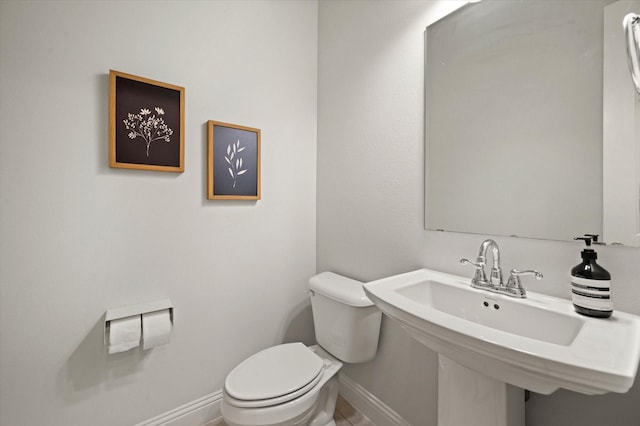 bathroom with sink and toilet