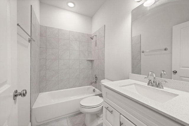 full bathroom featuring tile patterned flooring, vanity, toilet, and tiled shower / bath