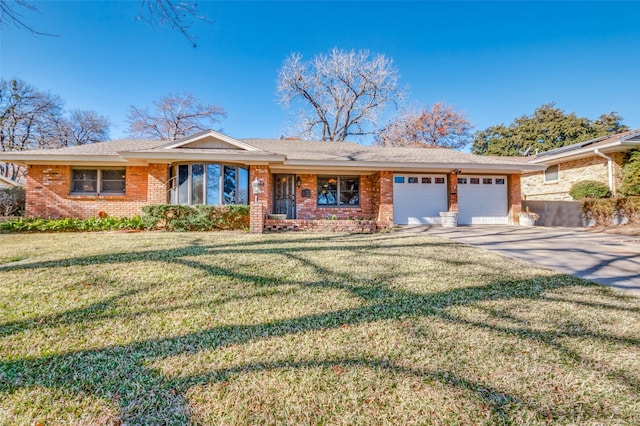 ranch-style home with a garage and a front lawn