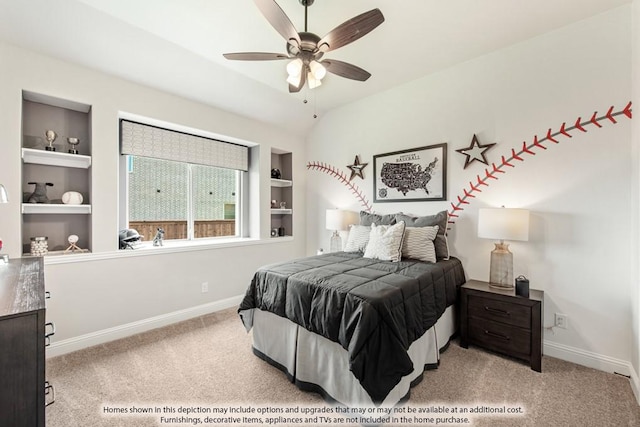 carpeted bedroom featuring ceiling fan and vaulted ceiling