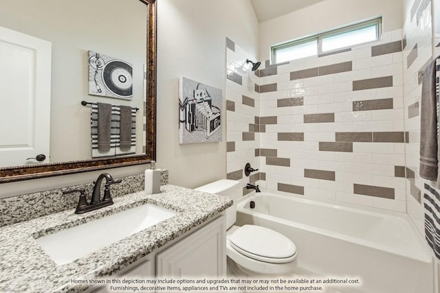 full bathroom with vanity, tiled shower / bath combo, and toilet