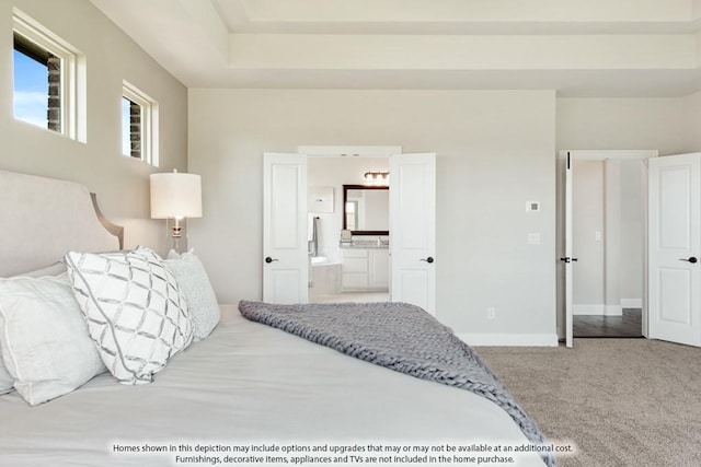 bedroom featuring connected bathroom and carpet floors