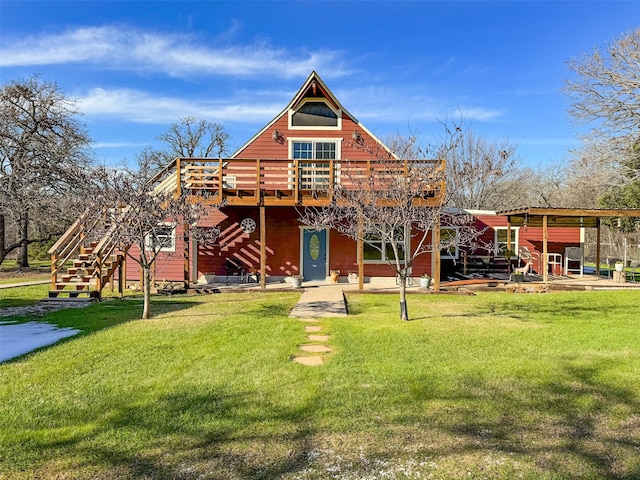 rear view of house featuring a yard and a deck