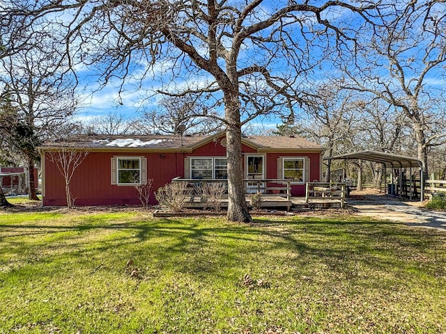 view of front of home featuring a carport, a front yard, and a deck