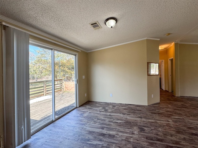 empty room featuring crown molding, a textured ceiling, and hardwood / wood-style flooring