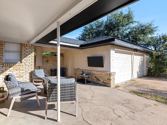 view of patio with a garage