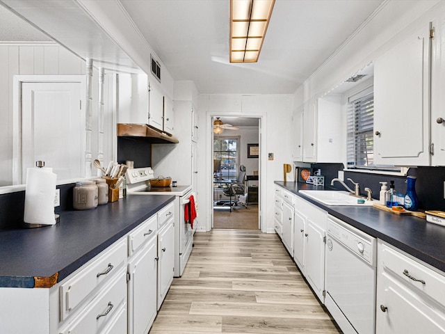 kitchen with white appliances, ceiling fan, sink, light hardwood / wood-style flooring, and white cabinets