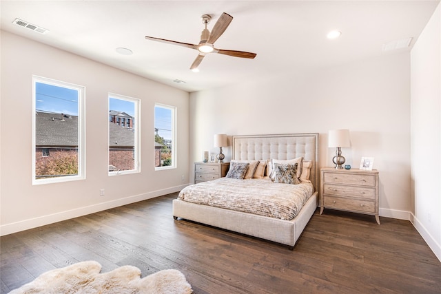 bedroom with ceiling fan and dark wood-type flooring