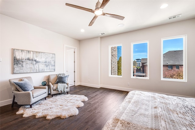 bedroom with ceiling fan and dark wood-type flooring