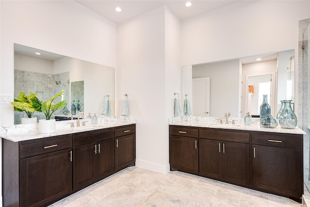 bathroom with vanity and a shower