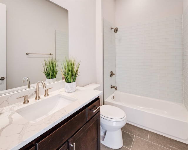 full bathroom with tile patterned floors, vanity, toilet, and tiled shower / bath