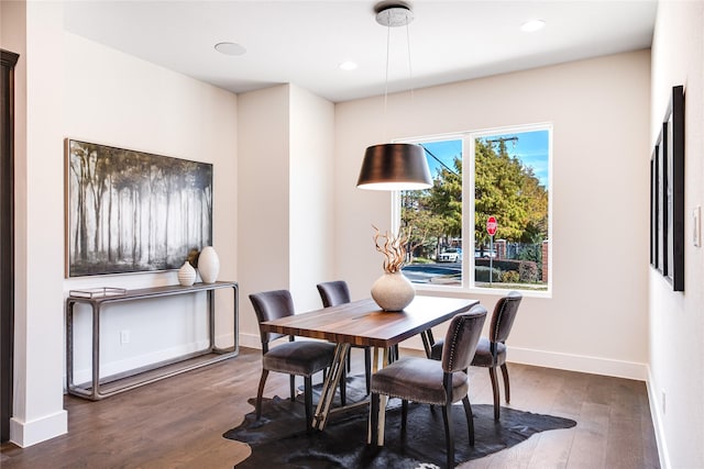 dining room with dark wood-type flooring