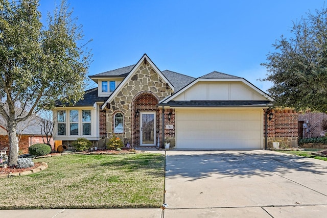 view of front of property with a garage and a front lawn