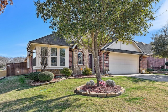 view of front of house featuring a front yard and a garage