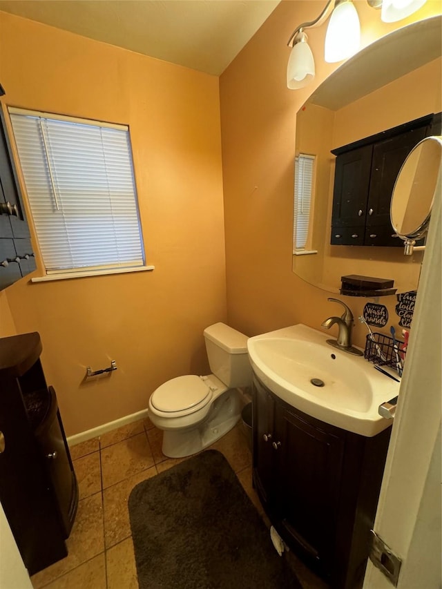 bathroom with vanity, tile patterned floors, and toilet