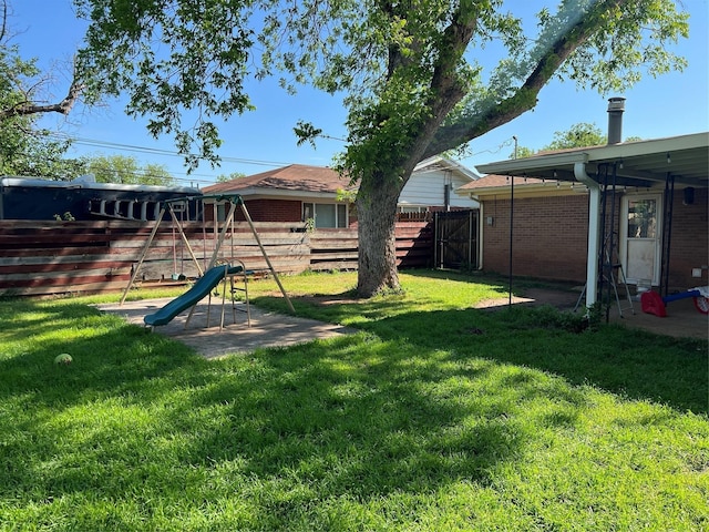 view of yard with a playground