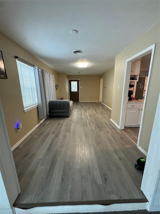 unfurnished living room featuring hardwood / wood-style flooring