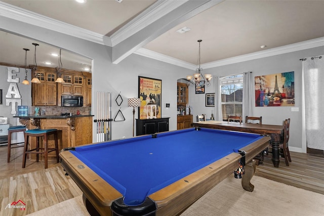 game room featuring light hardwood / wood-style flooring, a notable chandelier, crown molding, and pool table