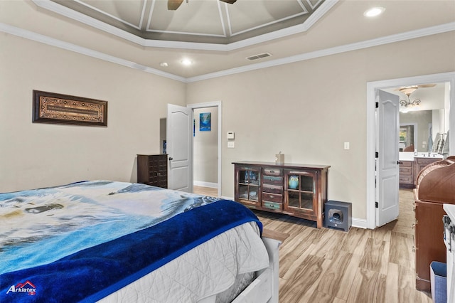 bedroom with ceiling fan with notable chandelier, a raised ceiling, ornamental molding, and light hardwood / wood-style flooring