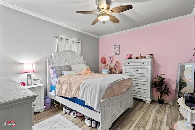 bedroom featuring light wood-type flooring, ceiling fan, and ornamental molding