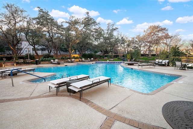 view of swimming pool featuring a patio area