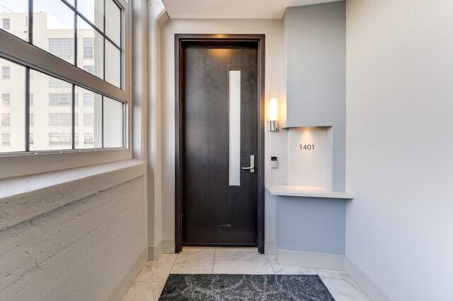 doorway to property featuring elevator