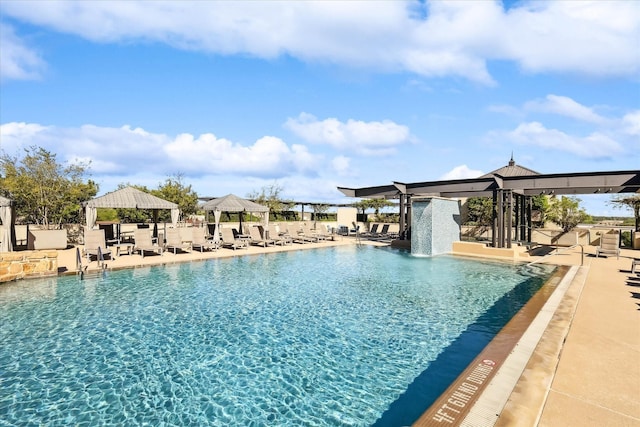 view of swimming pool featuring a gazebo, pool water feature, and a patio area