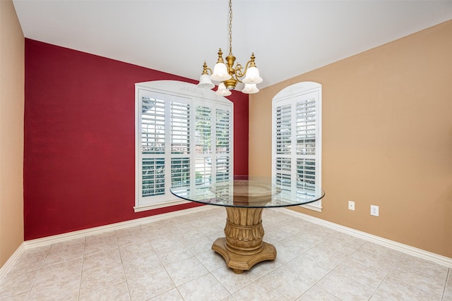 dining room featuring a chandelier, baseboards, and light tile patterned floors