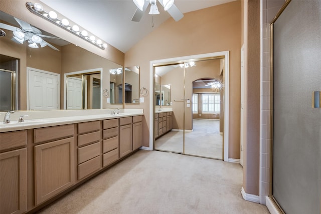 full bathroom with lofted ceiling, ceiling fan, carpet, and a sink