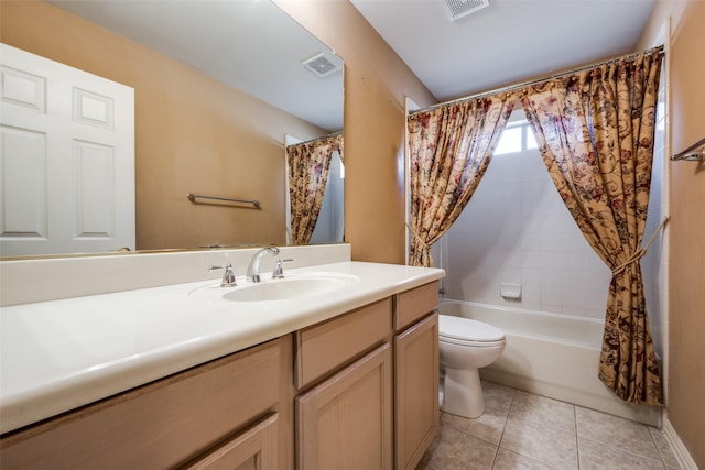 bathroom with visible vents, toilet, shower / bath combo with shower curtain, vanity, and tile patterned flooring