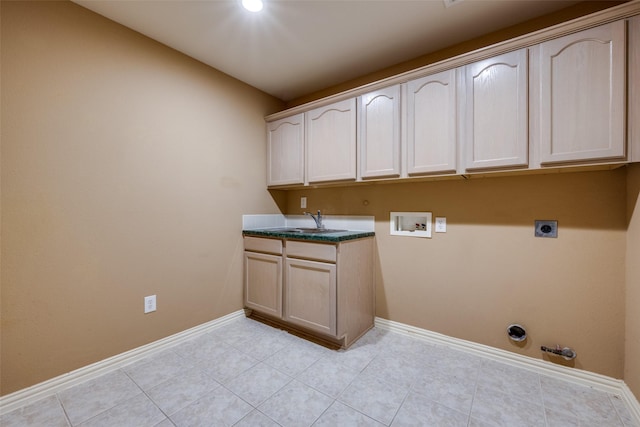 clothes washing area with cabinet space, baseboards, hookup for a gas dryer, hookup for a washing machine, and electric dryer hookup