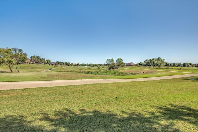 view of home's community featuring a lawn