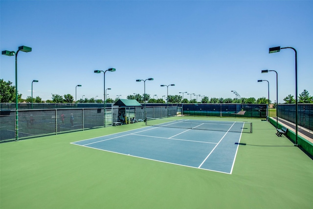 view of tennis court with fence