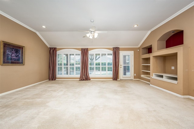 unfurnished room featuring built in features, vaulted ceiling, and ornamental molding