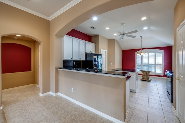 kitchen with dark countertops, white cabinets, black refrigerator with ice dispenser, and a peninsula