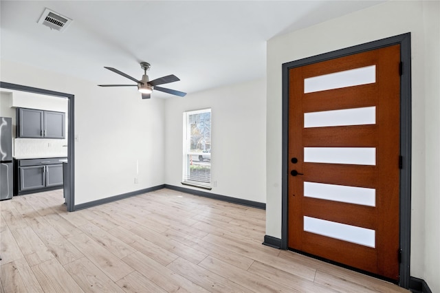 entryway with ceiling fan and light hardwood / wood-style floors