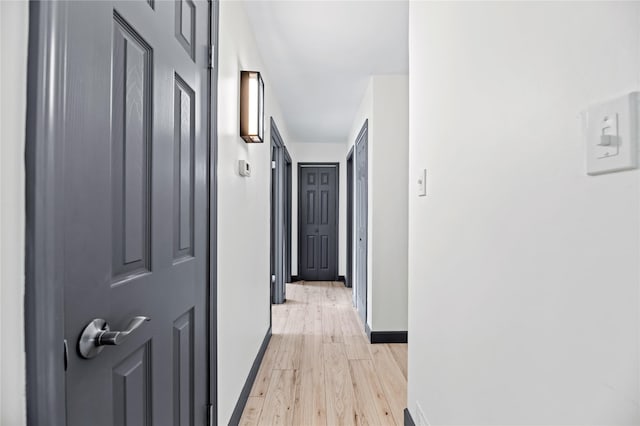 hallway with light wood-type flooring