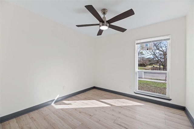 empty room with light hardwood / wood-style floors and ceiling fan