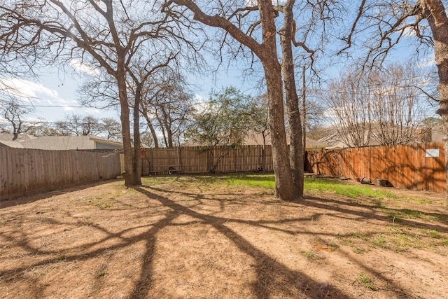 view of yard featuring a fenced backyard