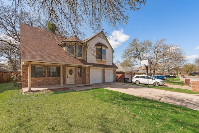 traditional-style house with a front yard, concrete driveway, fence, brick siding, and a garage
