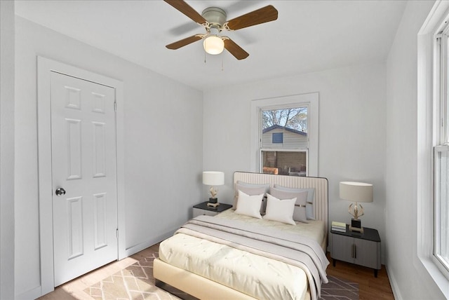 bedroom featuring ceiling fan and light hardwood / wood-style flooring