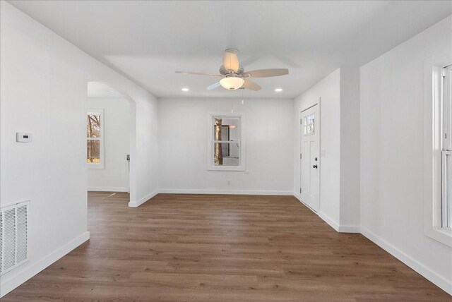 unfurnished room with hardwood / wood-style floors and ceiling fan