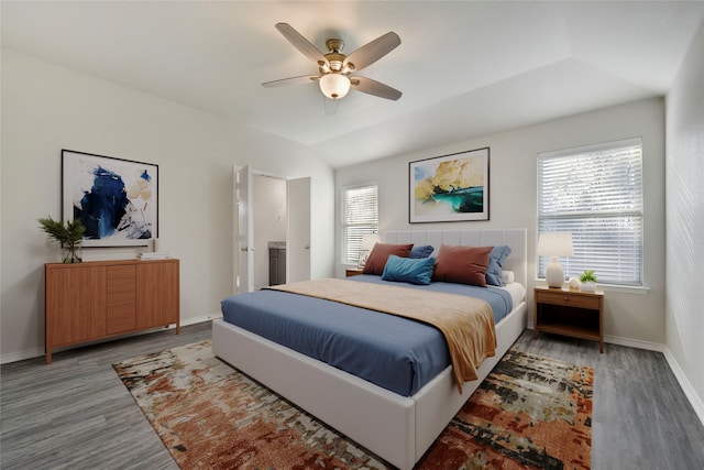 bedroom featuring hardwood / wood-style flooring, ceiling fan, and lofted ceiling