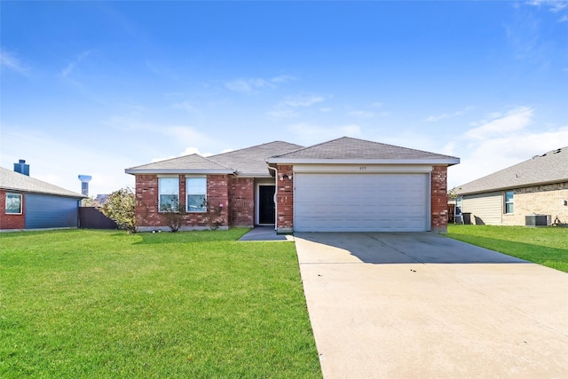 single story home with a garage and a front lawn