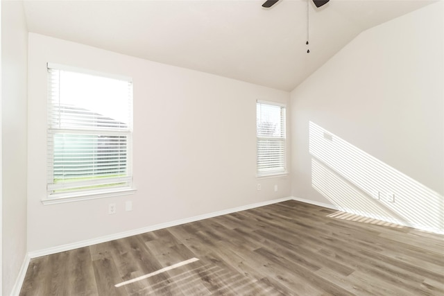 spare room with lofted ceiling, hardwood / wood-style floors, and ceiling fan