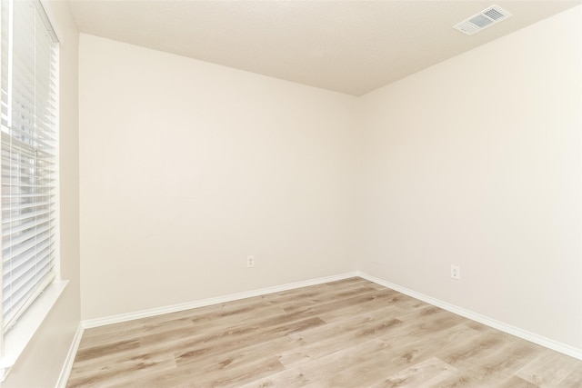 spare room featuring light hardwood / wood-style flooring