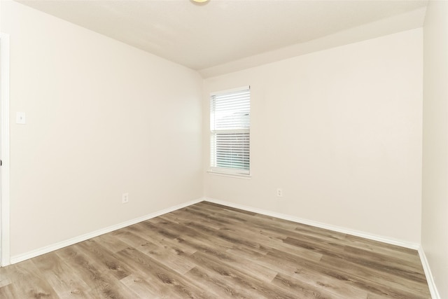 spare room featuring hardwood / wood-style flooring